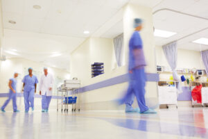 Blurred shot of doctors working in a busy hospital corridor