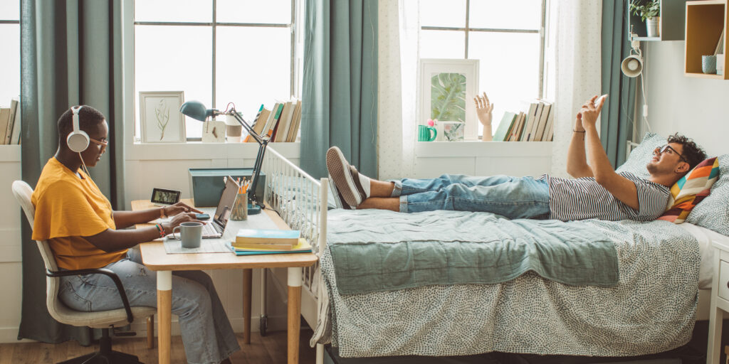 College students at dorm room. 